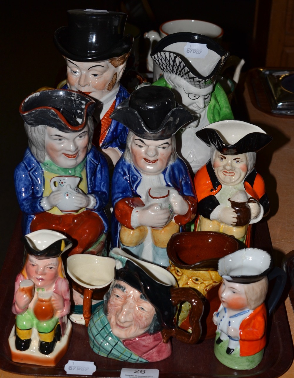 A quantity of Toby jugs (on one tray)