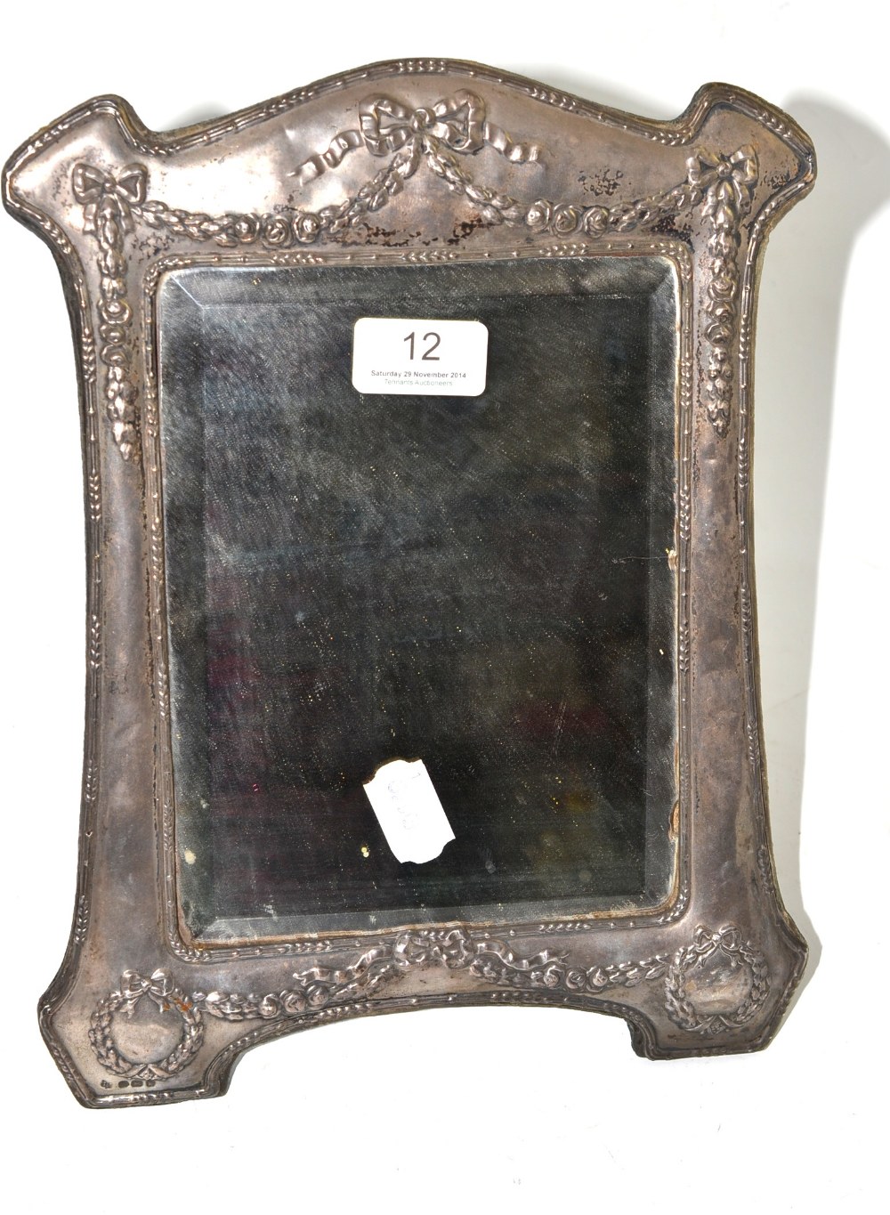 A silver framed easel back mirror