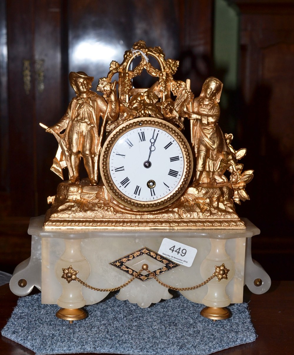 A spelter and alabaster clock with pendulum