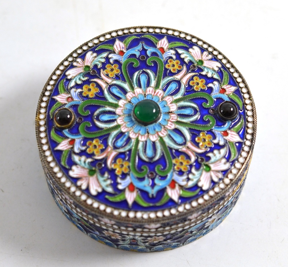 A Russian circular box with enamel decoration, bears Russian silver marks