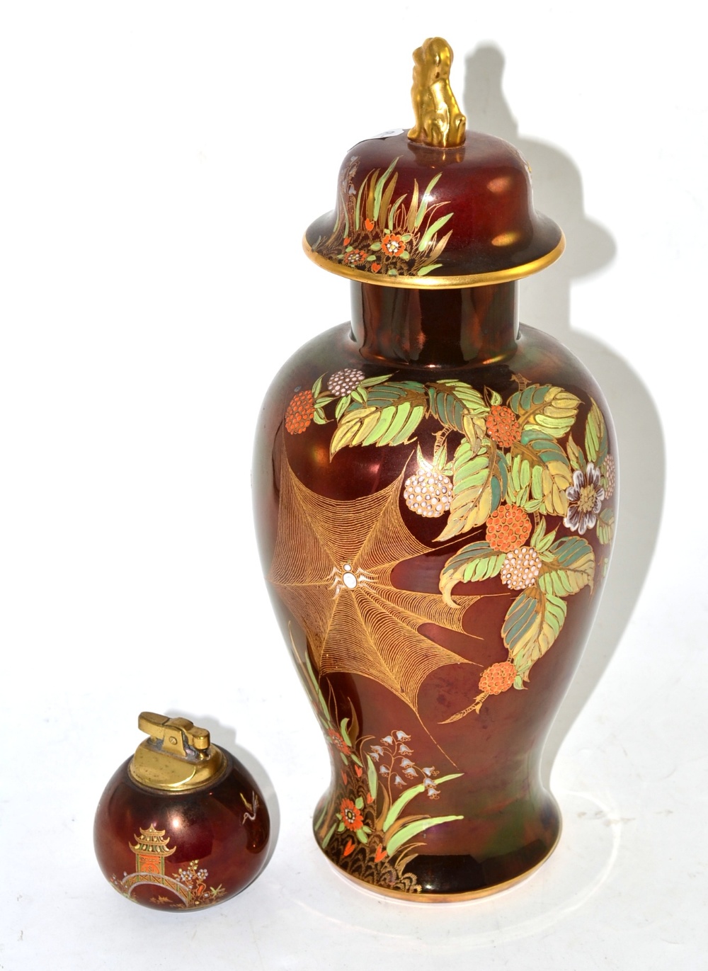 A Carltonware Rouge Royal Spider Webb vase and cover and a Carltonware Rouge Royal table lighter