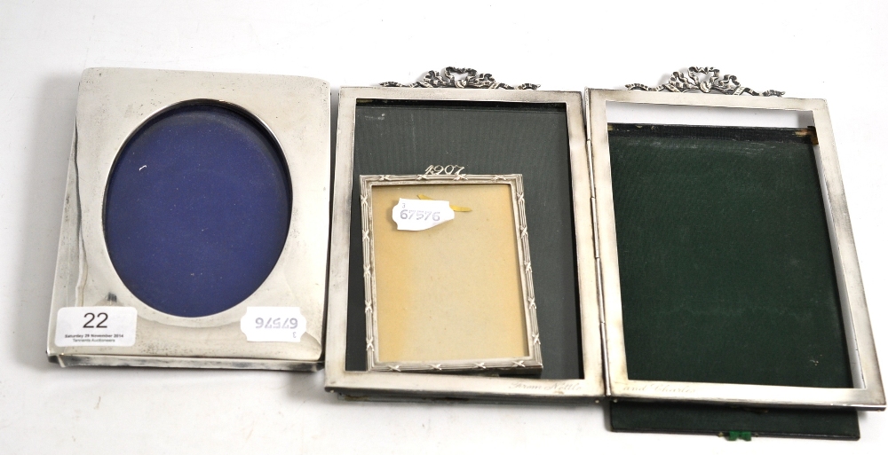 Three silver photograph frames