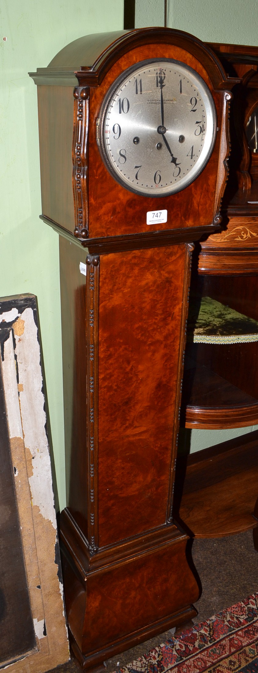 A small longcase clock retailed by Greenwood & Sons