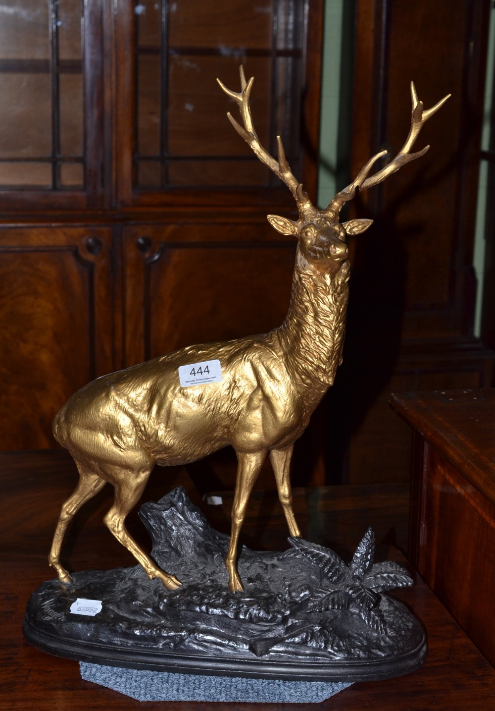 A spelter statue of a golden stag bears signature ``Waagen``