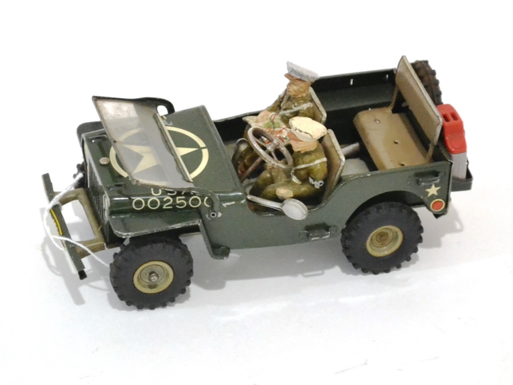 Arnold c/w US Military Police Jeep with fold down windscreen, two composition figures (one with