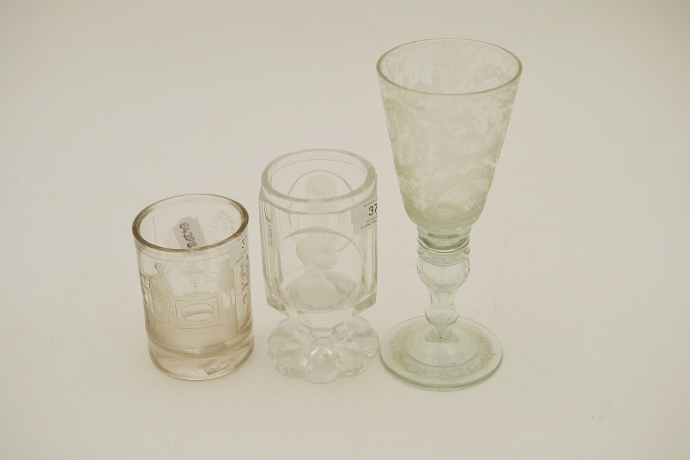 A Bohemian Glass Goblet, mid 19th century, the panelled cylindrical bowl engraved with two bust