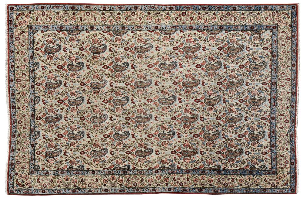 Good Ghom Rug Central Persia The ivory field with columns of boteh surrounded by flowers within