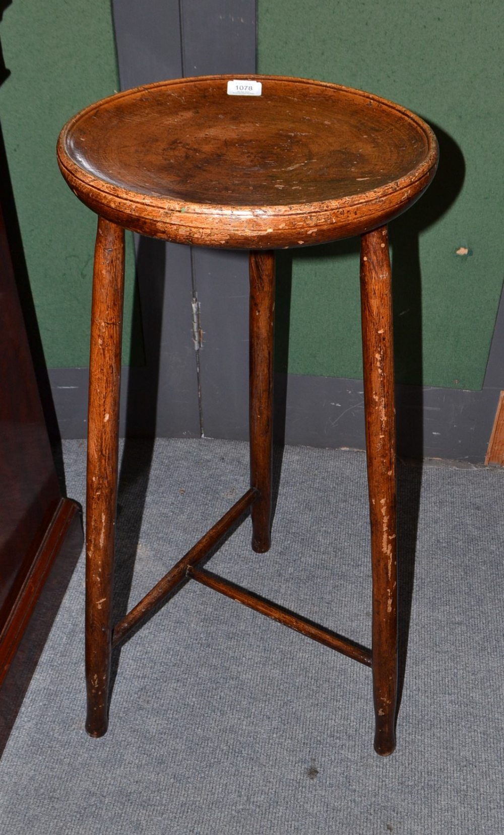 A George III Provincial Turned Oak Stilton Stand, late 18th/early 19th century, the dished top