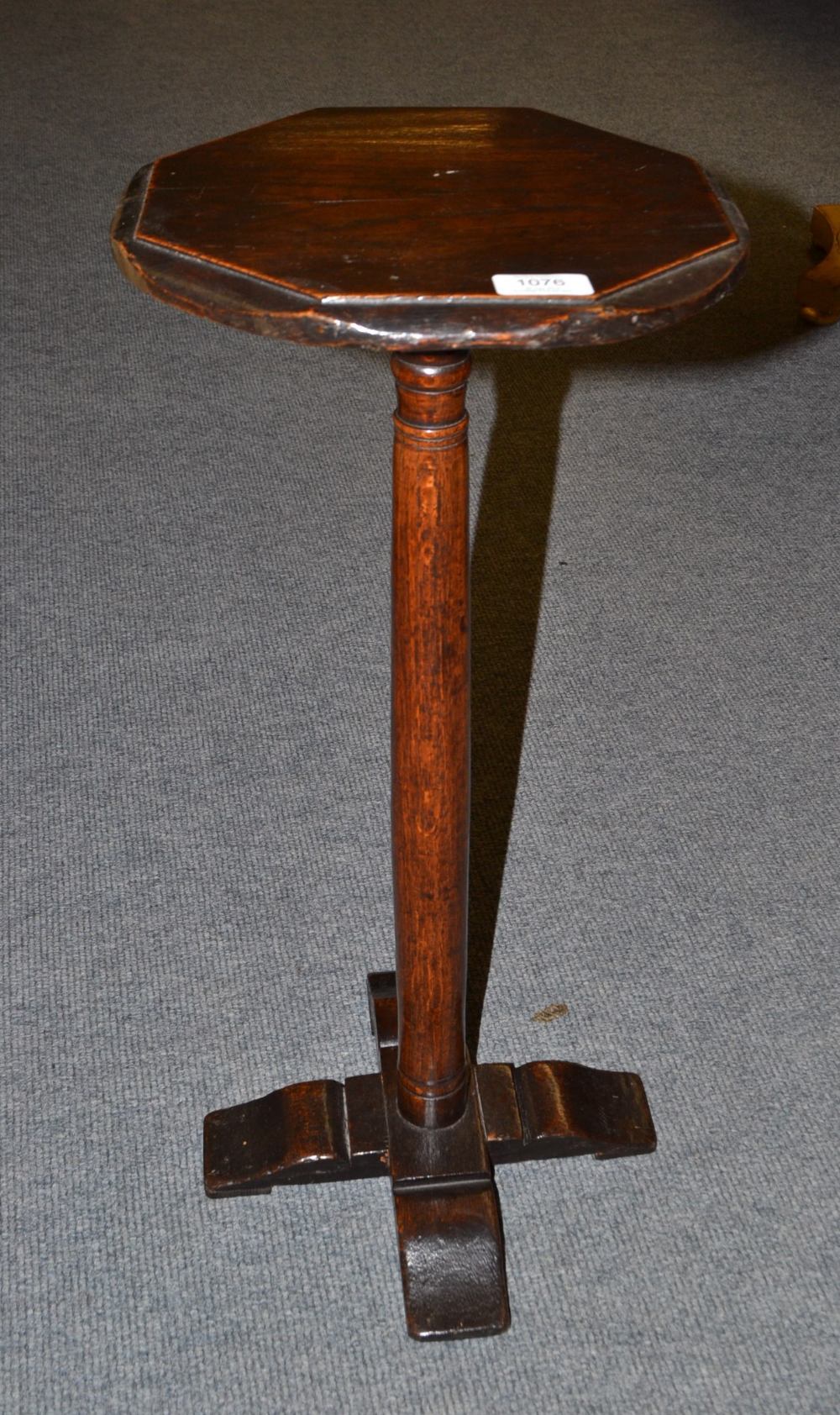 A Late 17th Century Oak Candle Stand, the circular top with octagonal shaped detail above a turned