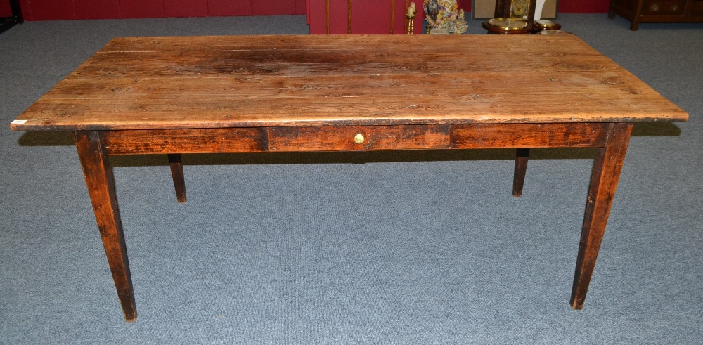 A 19th Century English Joined Oak Farmhouse Table, the plank top above a plain frieze and single