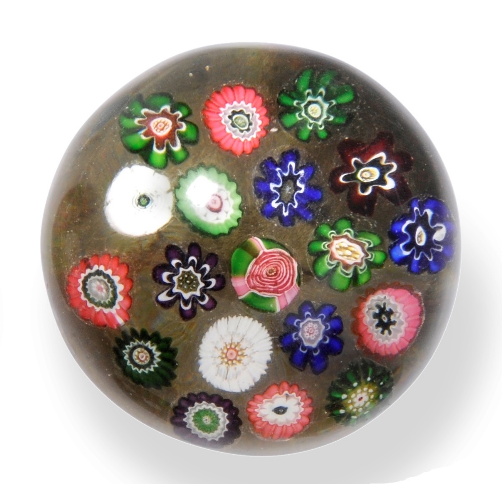 A Clichy Scattered Millefiori Paperweight, circa 1850, set with assorted canes, including a pink