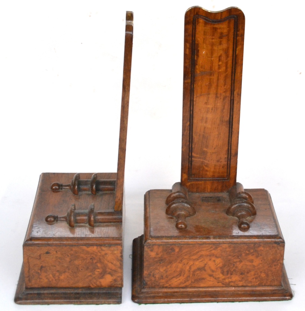 A Pair of Victorian Brown Oak Plate Stands, mid 19th century, with weighted square bases and applied