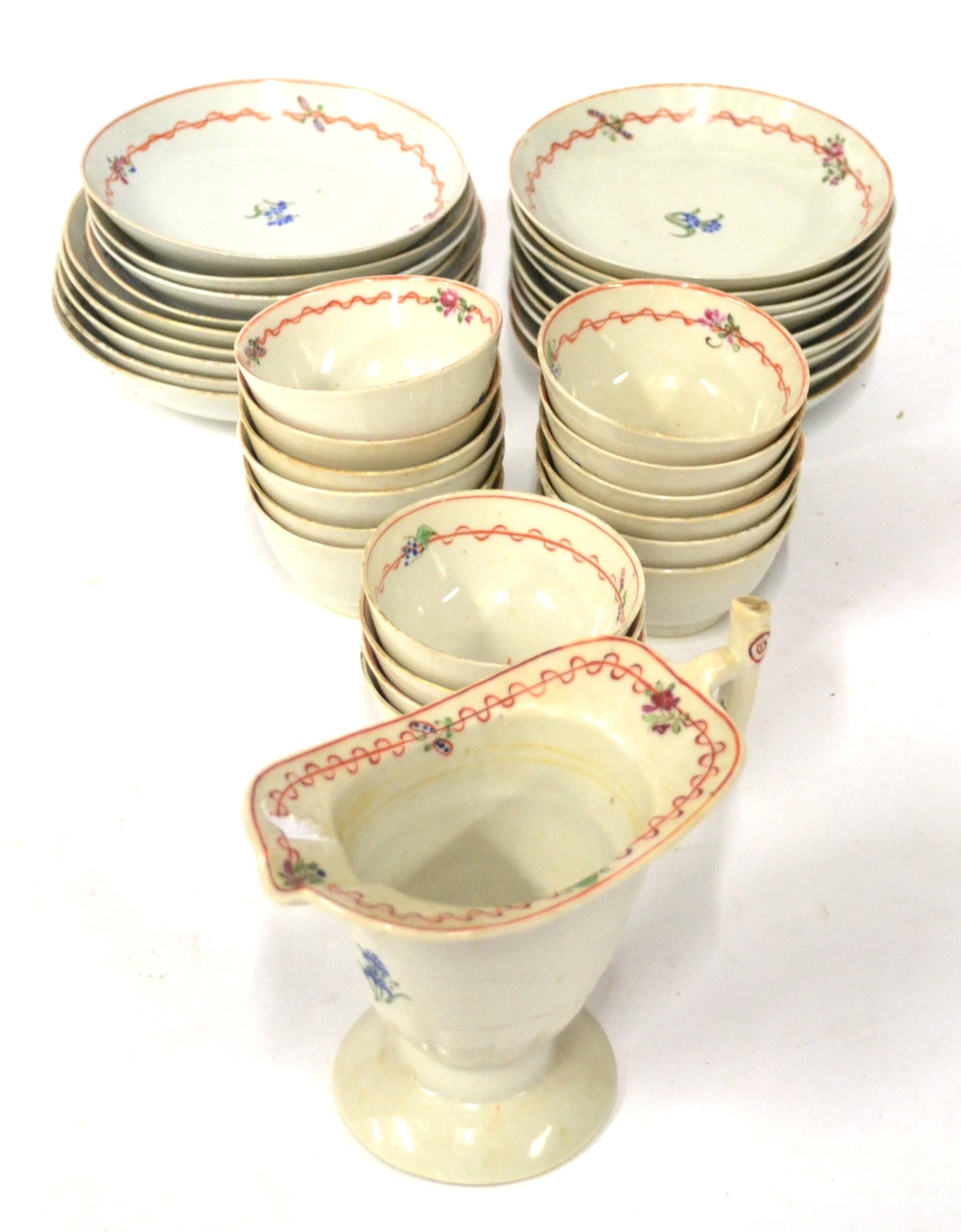 A Chinese Porcelain Tea Service, circa 1790, painted with forget-me-nots with ribbon tied foliate