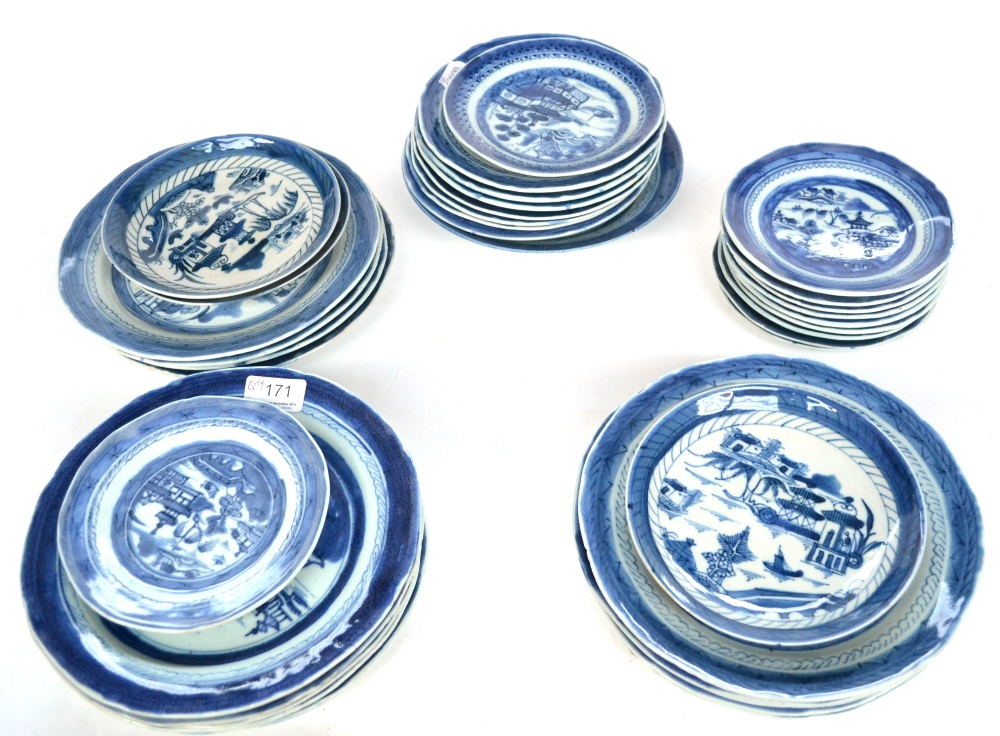 A Composite Set of Fourteen Chinese Porcelain Plates, circa 1800, painted in underglaze blue with