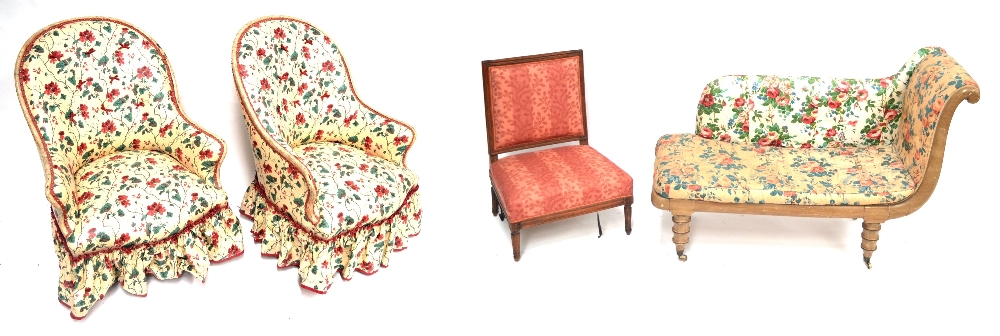 A Pair of Early 20th Century Armchairs, later recovered in close nailed floral fabric with painted