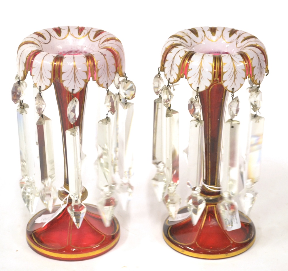 A Pair of Bohemian White Overlay Ruby Glass Table Lustres, circa 1860, the bowls as stiff leaves