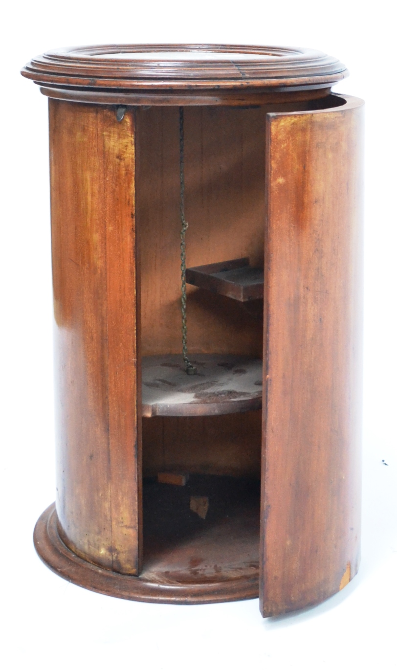 A Victorian Mahogany Cylindrical Pot Cupboard, mid 19th century, the moulded top with inset white