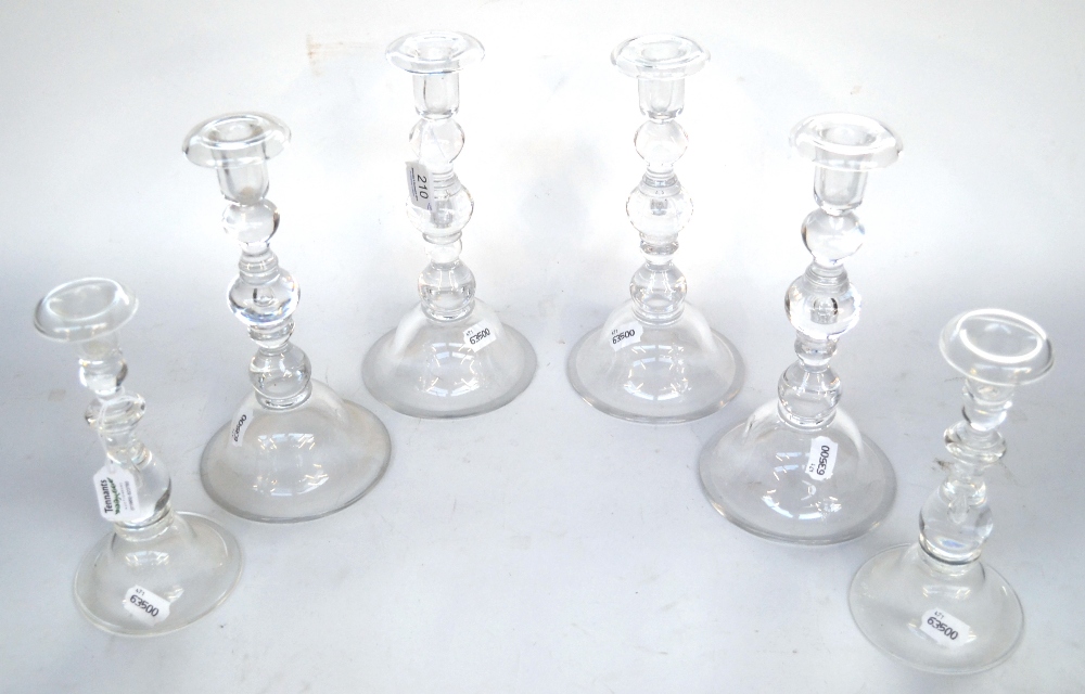 A Set of Six Glass Candlesticks, in 18th century style, with knopped stems and domed bases,