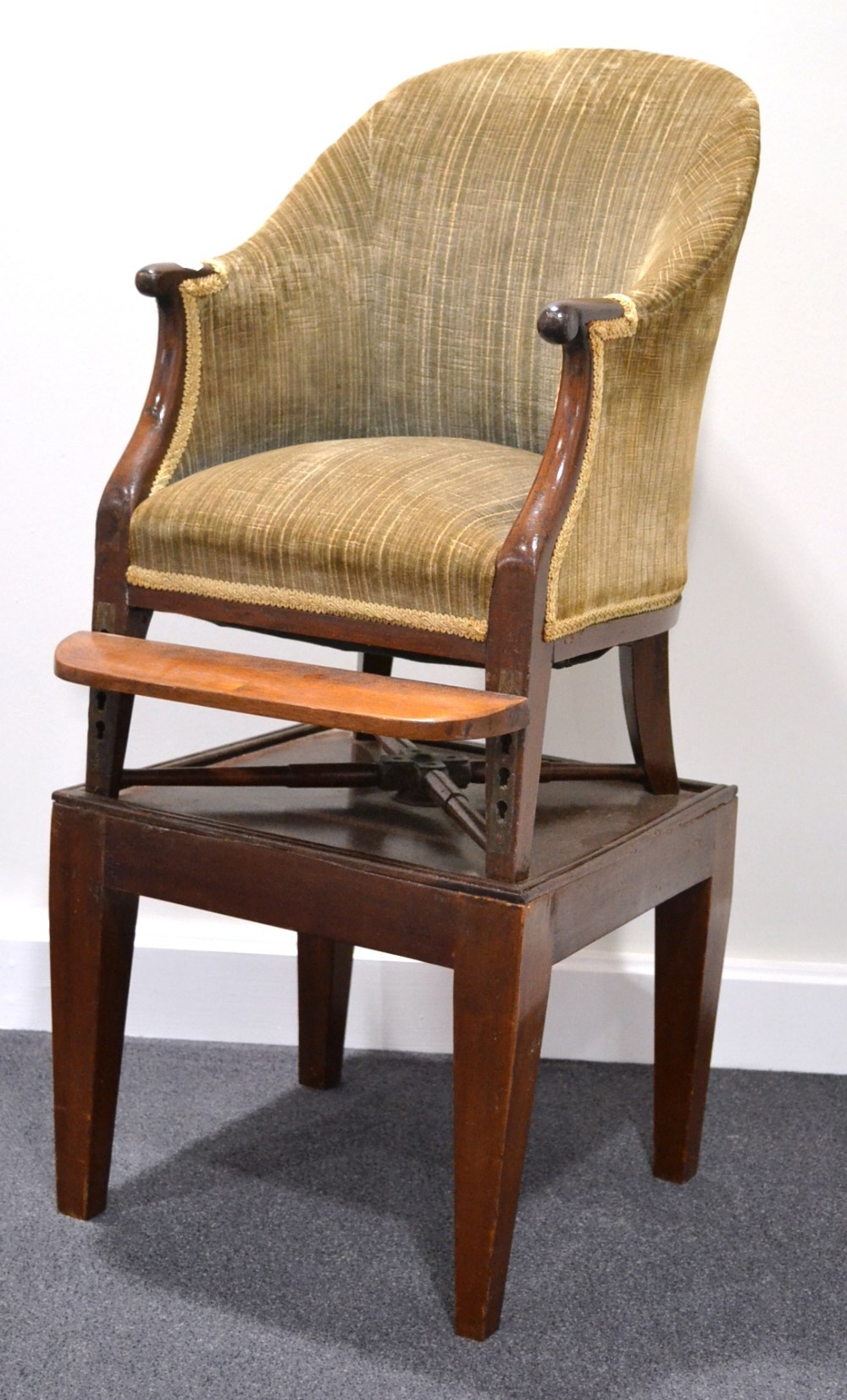 A Mid 19th Century Mahogany Child's Correction Armchair, recovered in grey velvet, the overstuffed