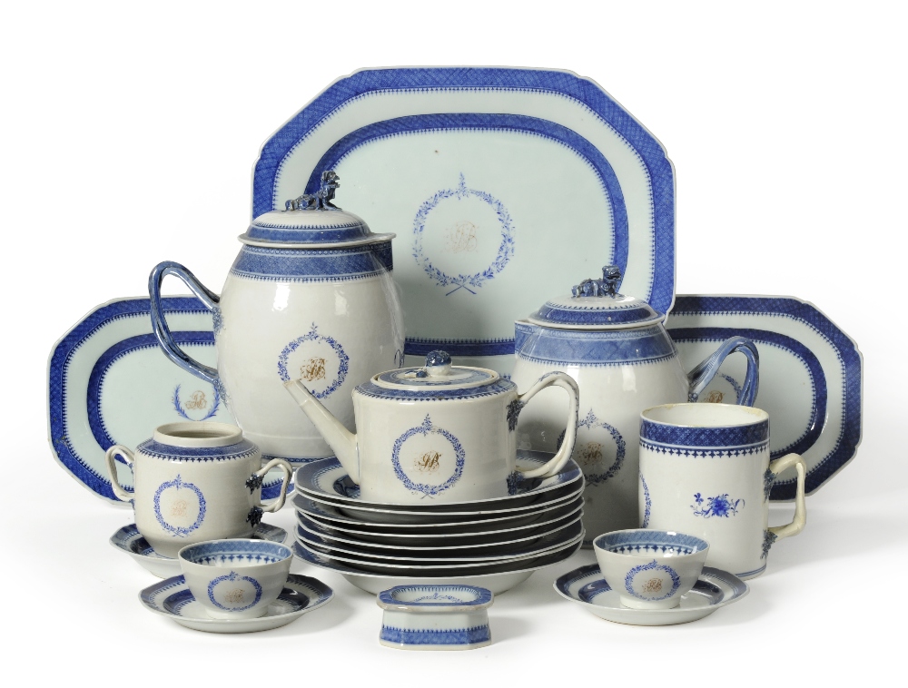 A Chinese Porcelain Dinner Service, circa 1790, gilt with a monogram within underglaze blue