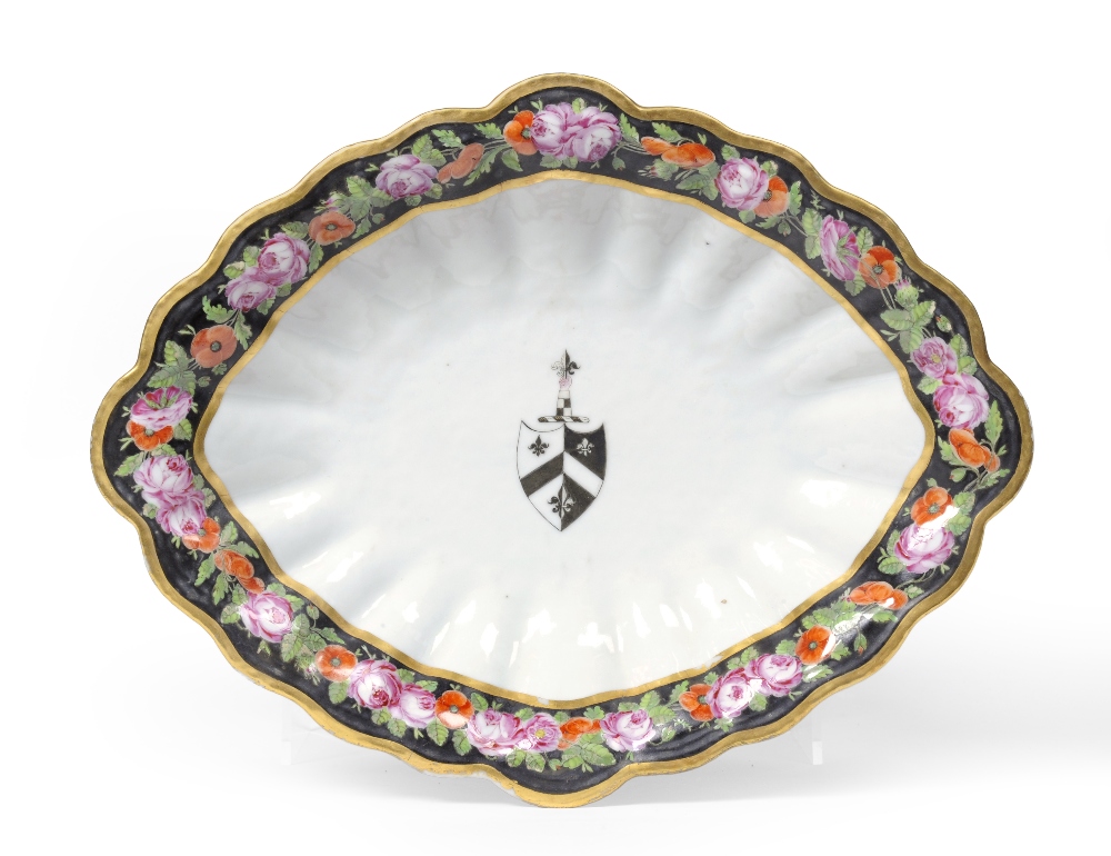 A Chinese Armorial Porcelain Dessert Dish, circa 1815, of fluted oval form painted in colours with
