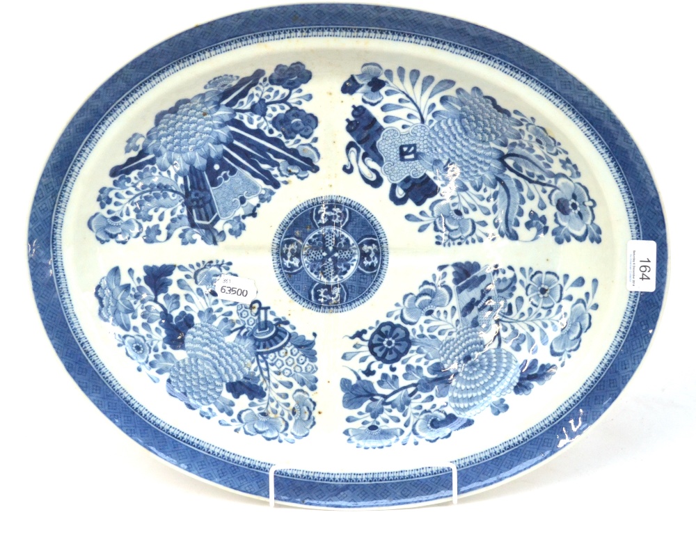 A Chinese Porcelain Oval Meat Platter, circa 1800, with tree and gravy well, painted in underglaze