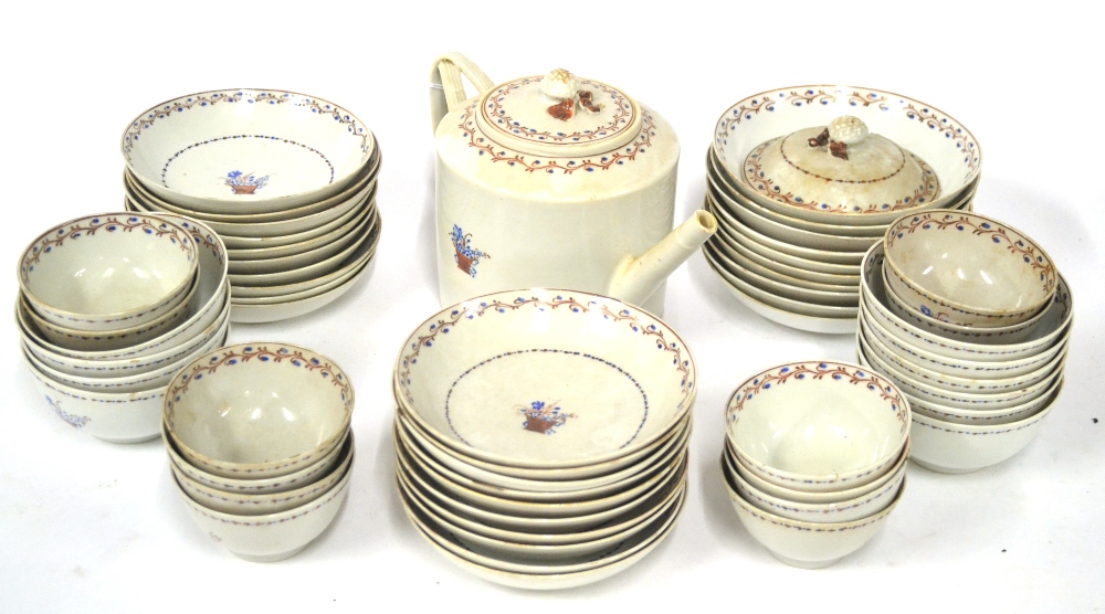 A Chinese Porcelain Tea Service, circa 1790, painted with a basket of flowers within a floral