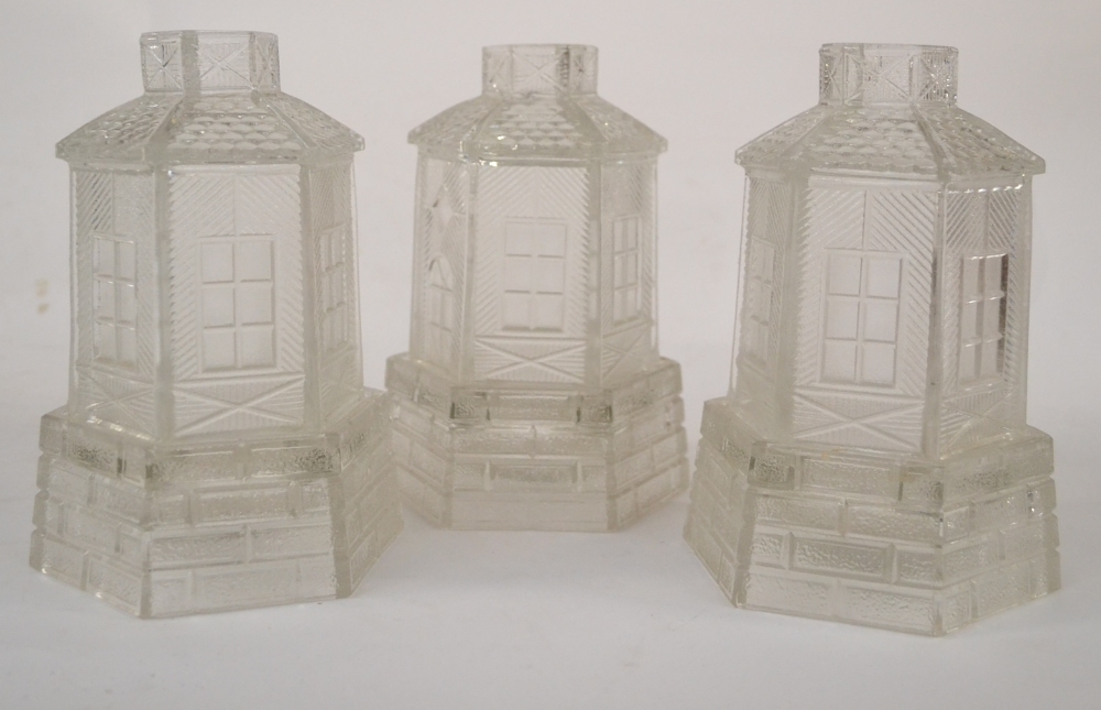 A Set of Eight Pressed Glass Night Light Holders and Stands, late 19th century, in the form of - Image 2 of 2