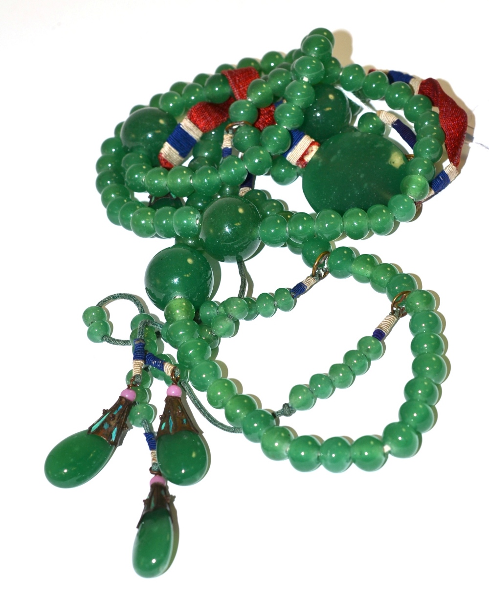 A Peking glass necklace, the green glass beads interspersed with larger beads at intervals, and