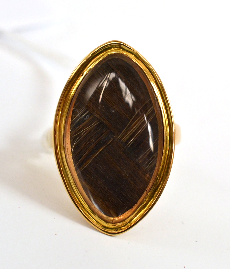 A mourning ring containing plaited hair, the lozenge frame engraved to the reverse `WS Ob 19th Oct