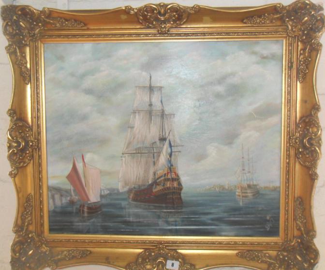 Gilt-framed marine oil painting of galleons