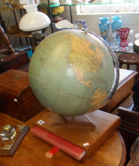 Philips "Challenge" globe with chromed arm on wooden base enclosing a Philips Record Atlas