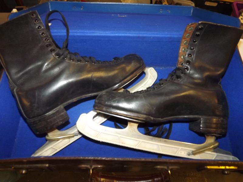 A leather case containing a pair of vintage leather ice skates, marked to the base 654018 G.B.P -