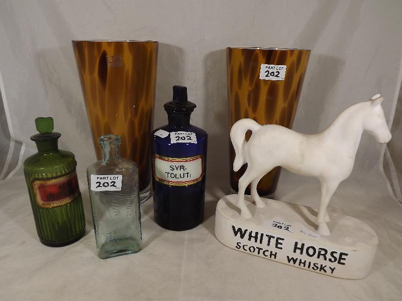 A pair of LSA International art glass vases, three chemist bottles and a White Horse Scotch Whisky