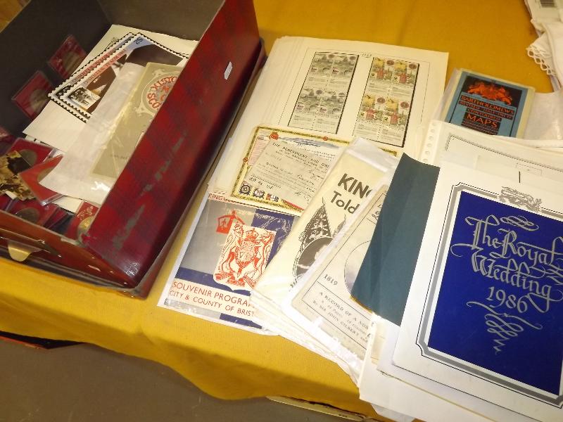 A box containing a collection of stamps mounted on sheets, royal ephemera and other - Est £50 - 70