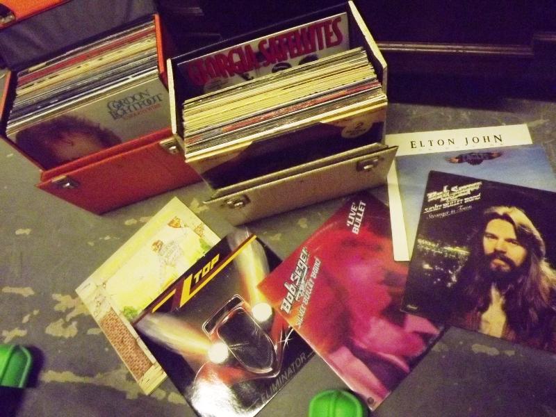 Two cases of 33.3 RPM vinyl record albums to include Elton John, Dire Straights, Eagles, ZZ Top
