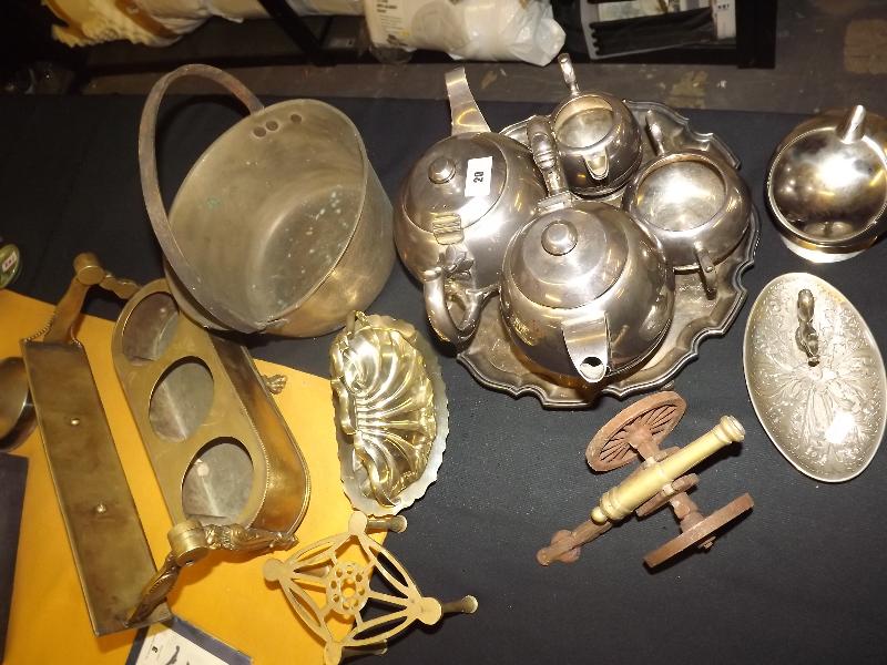 A large collection of plated ware to include tea pot, coffee pot, creamer and a brass jam pot and