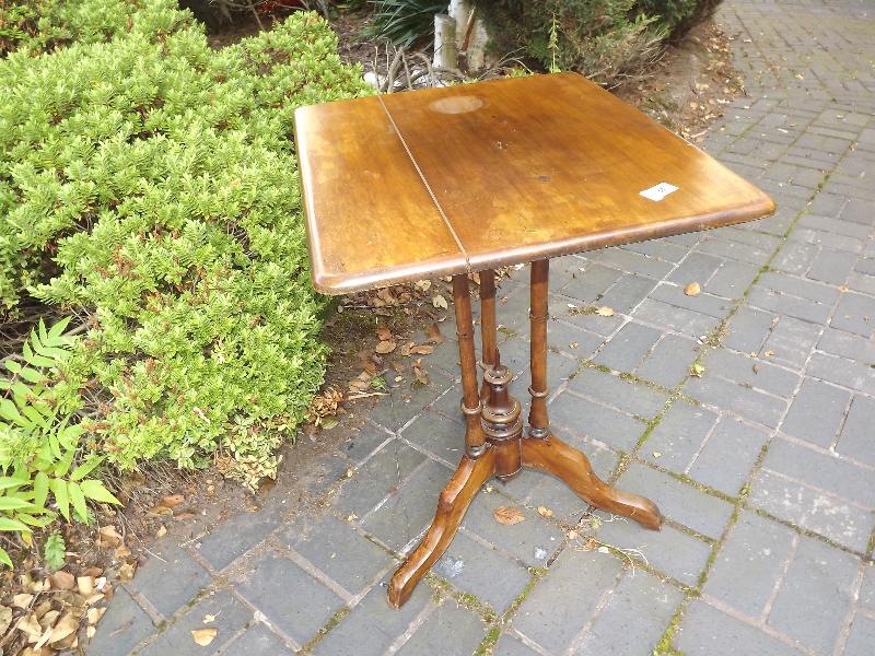 A small rectangular mahogany tilt-topped table, 69 cm x 48 cm x 55 cm