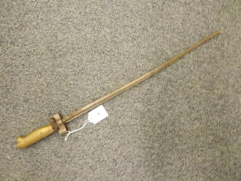 A British 1860 volunteer sword bayonet with Yataghan shaped steel blade and flat back, single fuller