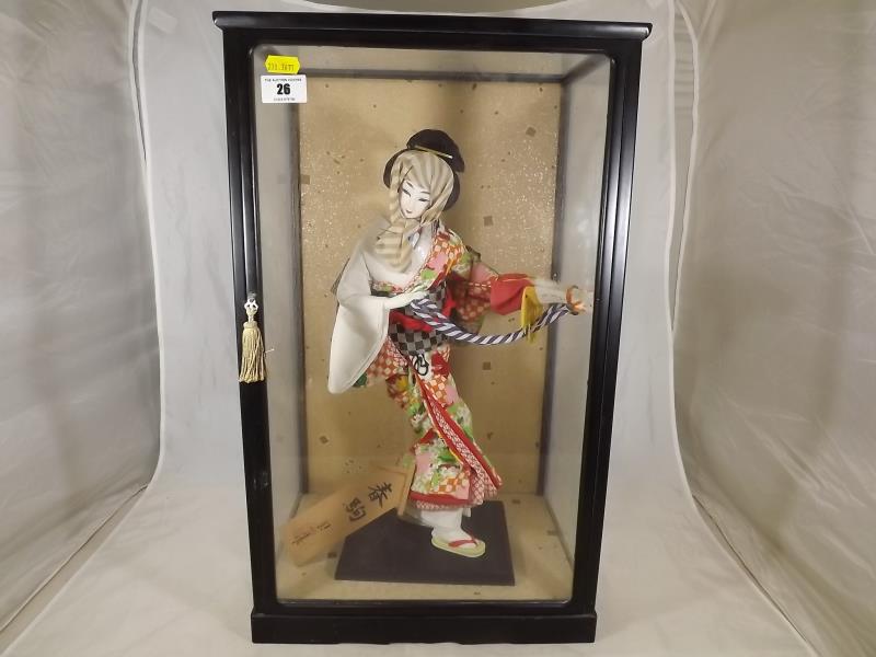 A hand painted Hakata doll in glass case, 54cm x 33cm x 26cm