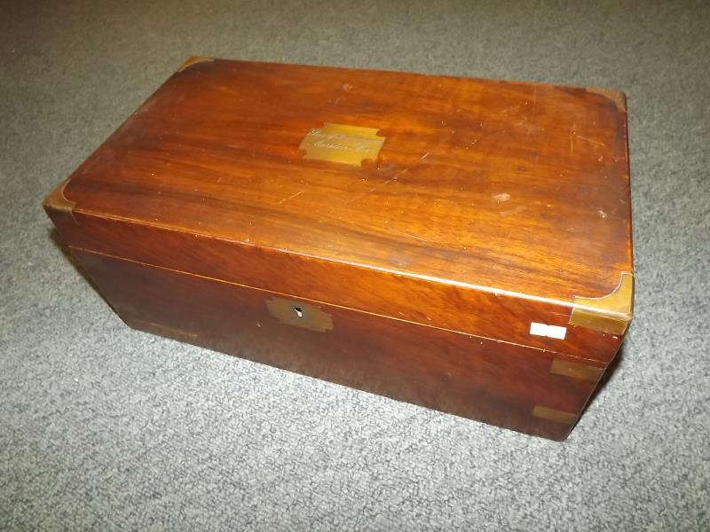 A mahogany writing slope with brass cartouche, inlaid brass corners and fitted interior 18.5cm (h) x