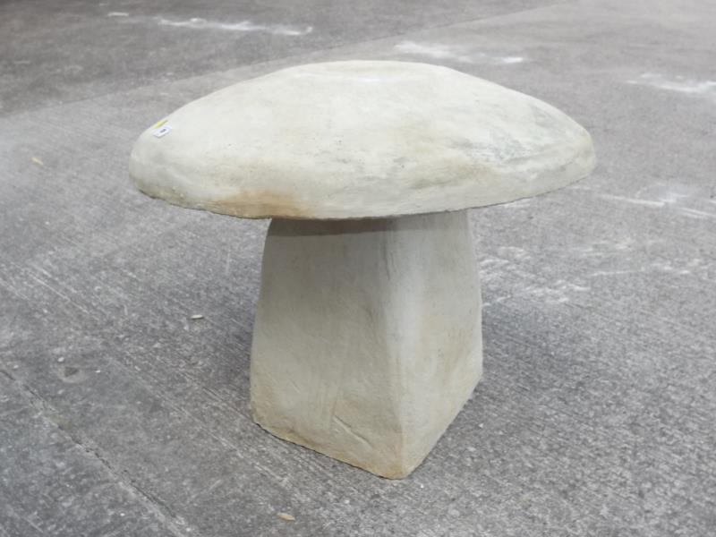 Stonework - A reconstituted stone sculpture in the form of a mushroom, 52cm (h) x 56cm (dia).