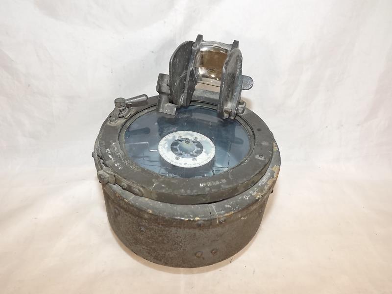 A World War Two (WWII) military compass inscribed A Zimuth Circle No.4 ref No.64/890 0-21 compass
