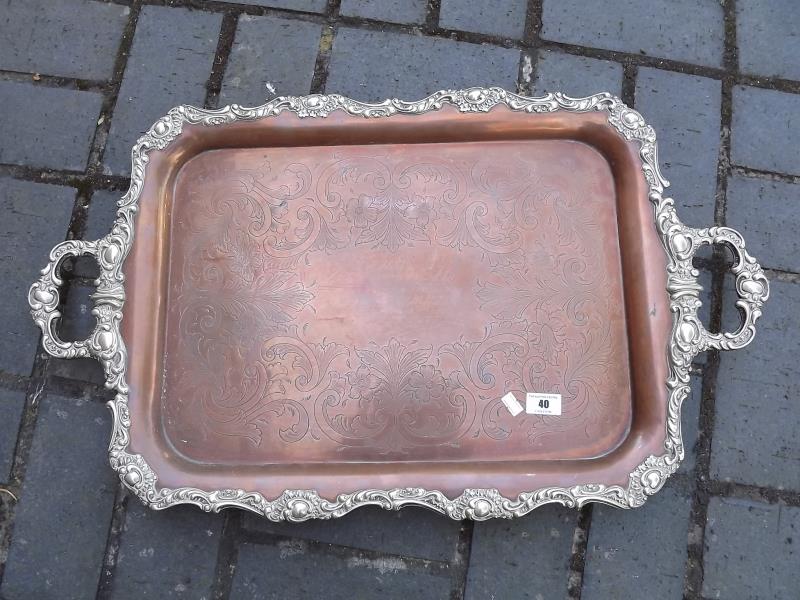 A large copper serving tray with plated scrolled border, 73cm (l) x 43cm (w)