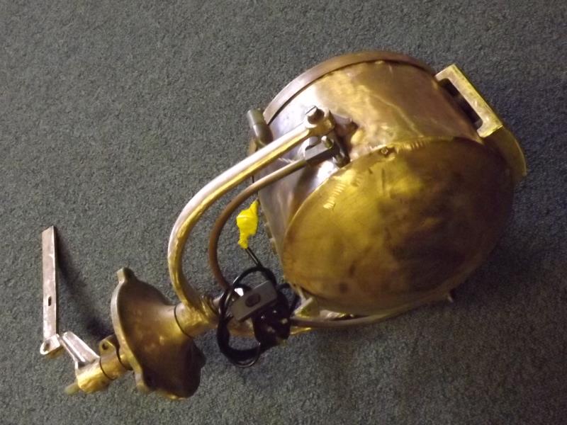 An early 20th century brass ship's searchlight with later conversions