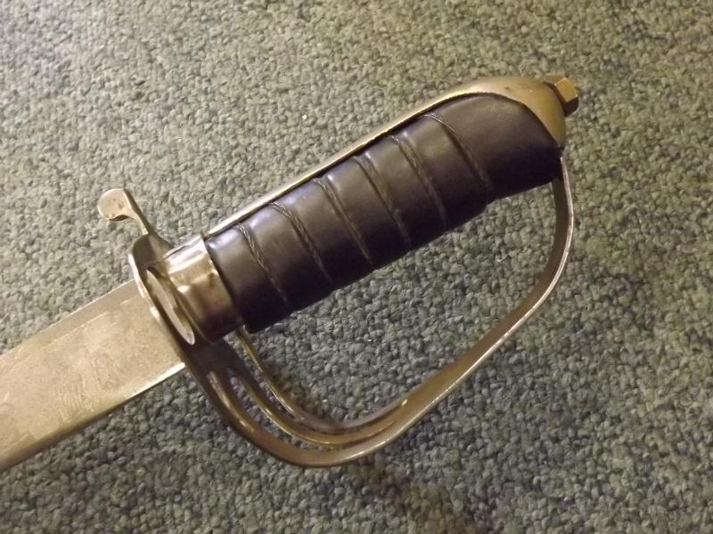 An 18th century army / light cavalry saber with leather grip and full basket guard, the blade - Image 2 of 6