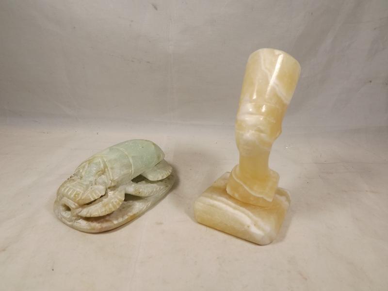 Two Egyptian figurines, one a jade Scarab, 8 cms (l) and a marble figurine in the form of the