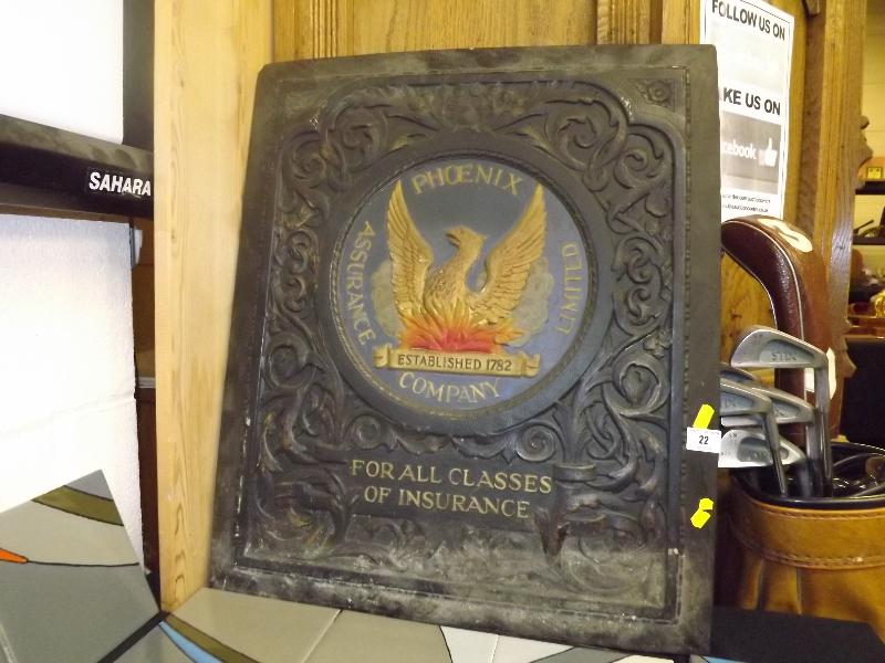 A Phoenix Assurance Company Limited plaque `For All Classes of Insurance`, with carved foliate