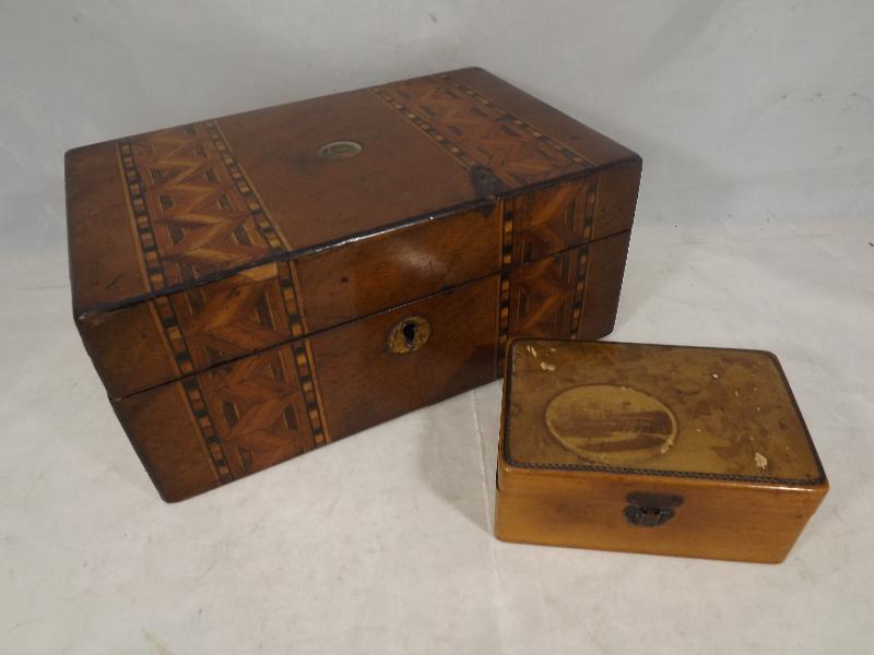 A small wooden chest with inlaid decoration, 9 cm x 20.5 cm x 13 cm and one other, its upper surface