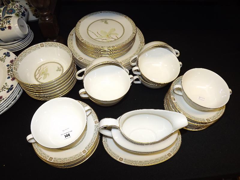 A Royal Doulton dinner service decorated in the White Nile pattern TC1122, eight place setting